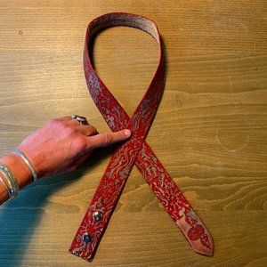 Custom hand-tooled snowflake pattern leather belt